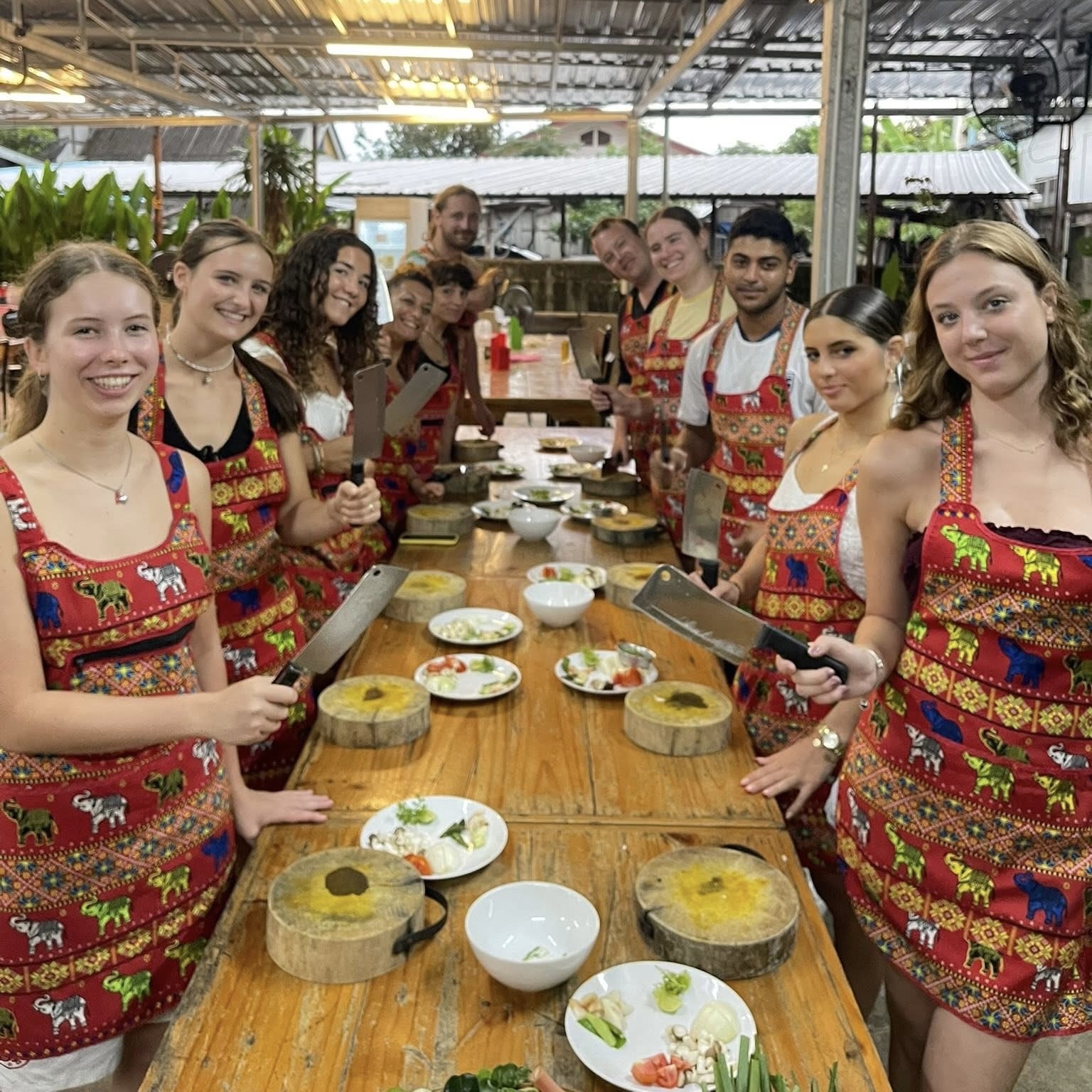 Authentic Pad Thai being cooked in a wok at Thai cooking class in Chiang Mai